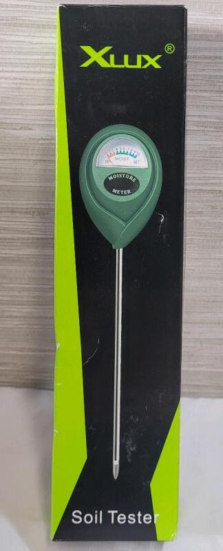 New - Xlux Soil Moisture Meter Tester w/Plant Watering Guide on Box . No Batteries Required