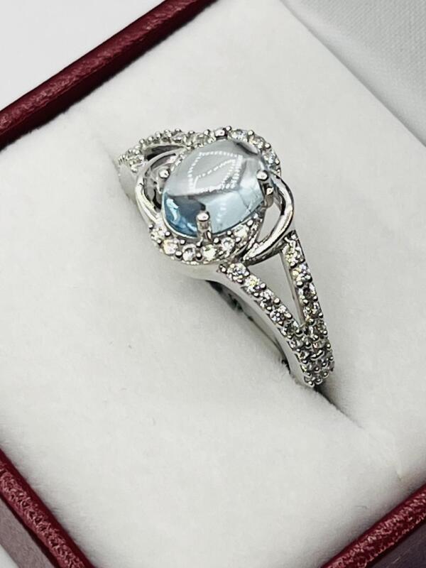 Sterling Silver Natural Blue Topaz (1.75ct) with CZ (0.20ct) Ring, Size 7.5, comes with appraisal $260.00. Blue Topaz is the birthstone for November.