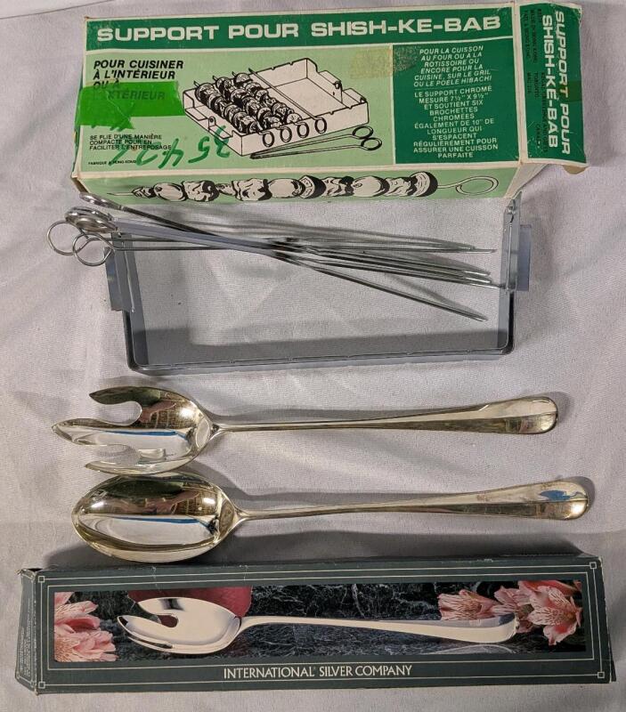 As New Untensil Lot. Shiskebob Holder and Silver plated Serving Utensils. Utensils measure 13" long