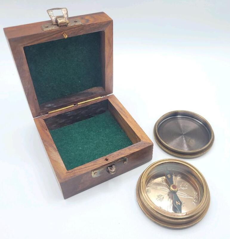New Brass Compass w/Screw on Lid in Wooden Box . Measures 2 ⅜" diameter.