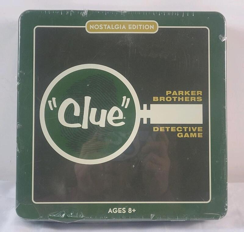 As New , Sealed - CLUE Board Game - Nostalgia Edition in Metal Case . Ages 8+ , 3-6 Players . Small Dent bottom edge .