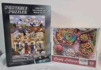 Two (2) 1000pc. Puzzles . One (1) New & Sealed - Candy Lollipops & One (1) Open - No Mat .