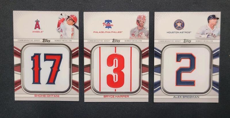 2022 Topps MLB Baseball Player Jersey Commemorative Medallion Trading Cards . Shohei Ohtani 17 # JNMSO , Bryce Harper 3 # JNM-BH & Alex Bregman 2 # JNM-AB .