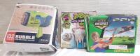 3 Kids Toys Including Electric Bubble Machine, Holographic Slime & Kite Catapult Gun | Packages Are Visibly Warped and Damaged, Products Still Inside. Some Products Not Tested For Functionality, Sold As Is
