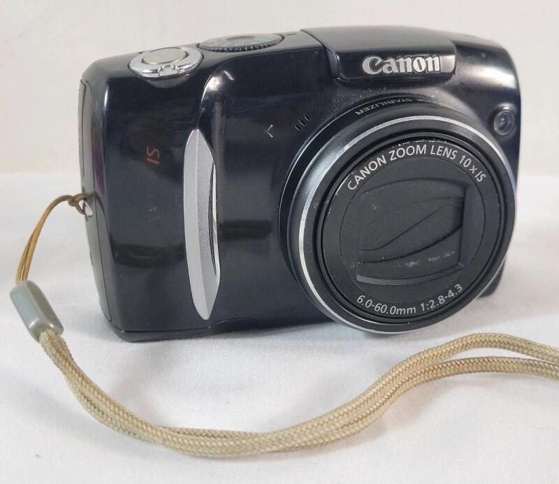 Canon PowerShot SX120 IS Digital Camera . Tested Powers Up , Requires 2 AA Batteries (not included)