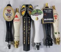 Six (6) Beer Taps . Bass , Mills St. Brewery , Great Lakes Brewery , Magners & Tennents . Measures 9" - 11" tall . Wear from use .