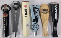 Six (6) Beer Taps . Okanagan Spring , Strong Bow , Side Launch , Black Oak & Sapporo . Measures 9 &frac14;" - 10 &frac34;" tall . Wear from use .