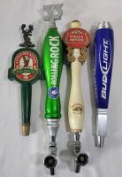 Four (4) Beer Taps . Alexander Keith's , Rolling Rock , Stella Artois & Bud Light . Measures 11.5" - 16.5" tall . Wear from use .