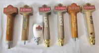 Seven (7) Sleeman Beer Taps . Measures 4.5" - 9.5" tall . Taps have wear from use .