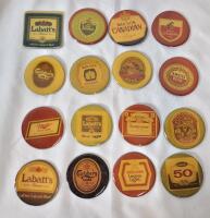 16 Vintage Refrigerator Beer Magnets . Measures 1 ⅞" diameter .