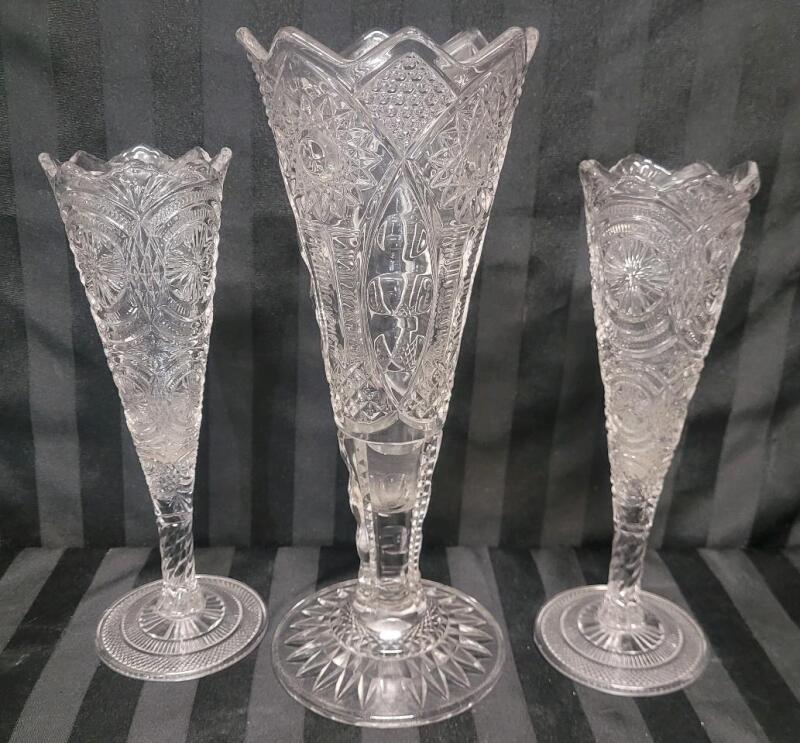Vintage Pressed Glass Trumpet Vases with Diamond Cut Design Style Motifs . Measures 10" & 12" tall .