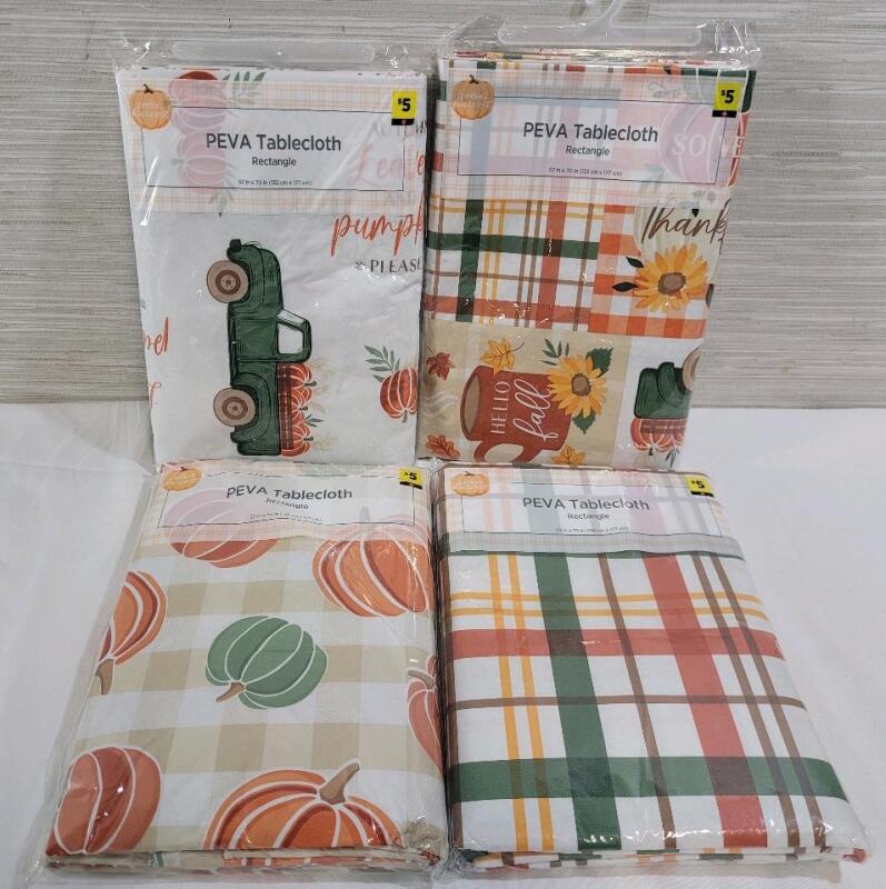 Four (4) New Seasonal Tablecloths . Each measures 52"&times;70" .