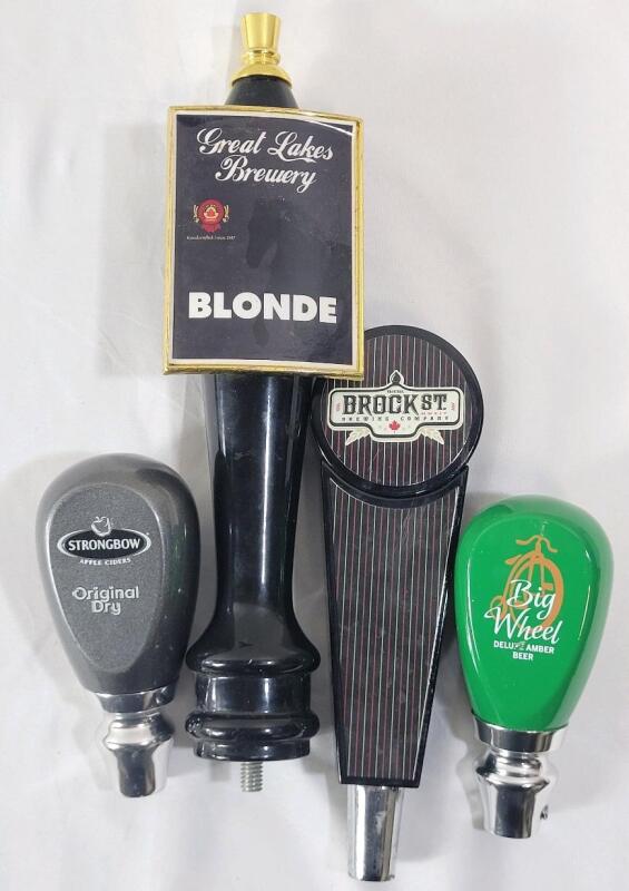 Four (4) Beer Taps . Great Lakes Brewery , Brock St. Brewery , Strongbow & Big Wheel . Measures 4 &frac34; - 10.5" tall . Wear from use
