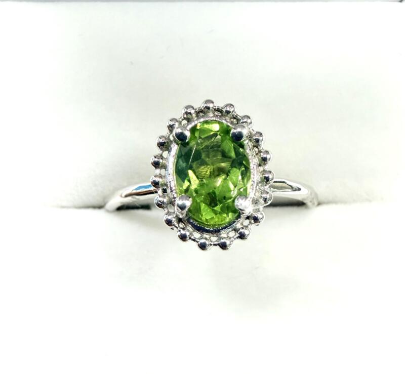 10KT White Gold Natural Peridot (0.75ct) Ring, Size 6.25, W/A $1200.00. Peridot is the birthstone for August.