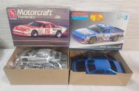 Two (2) 1/25 Scale Race Car Model Kits . One (1) Unstarted - Sealed & One (1) Started