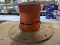 Anixter 6 Fiber Jumper Cable. Unknown length. Spool measures 23.5" diameter.