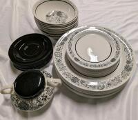 32 Pieces of Dishware. All White Pieces are marked Wildwood. Largest Plate measures 10" Across