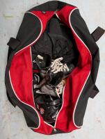 Canada Duffle Bag and Assorted Kids Hockey Equipment.