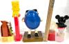 Character Candy Dispensers and BanksLot: Bart Simpson Giant PEZ, Blue M&M Dispenser, Mickey Mouse Gumball Bank, Wile E. Coyote 1998 - 2