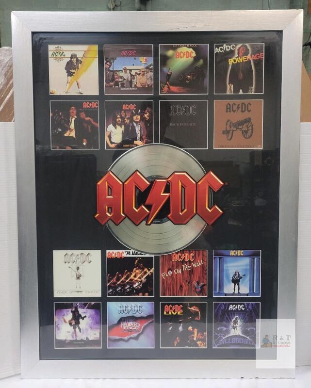 AC/DC Discography Framed Memorabilia Collage Featuring Miniature Replica Album Covers and Central Record Album Logo . Measures 29.5"&times;38.5"