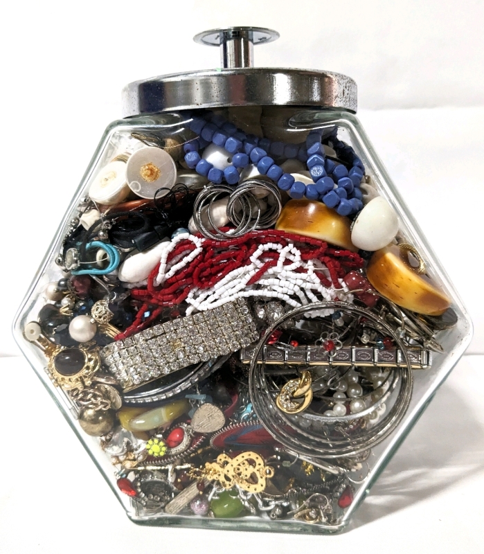 Unsorted Craft Jewelry Lot in Glass Container with Lid.