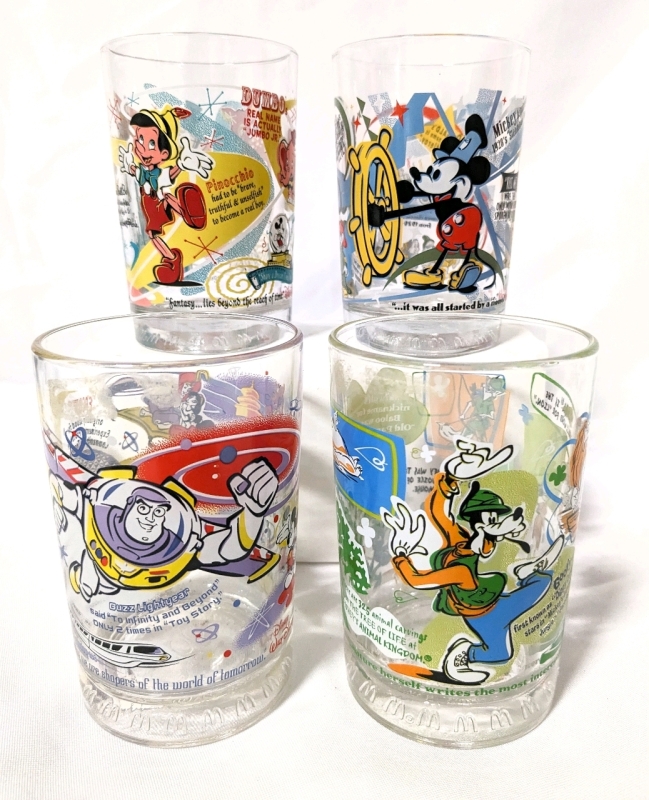 4 Vintage 2002 McDonald's x Walt Disney World 100 Years of Magic Collectable Drinking Glasses.