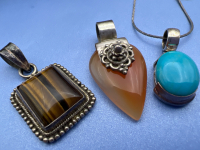 Three stamped 925 Pendants with stunning Stones