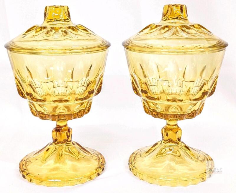 Indiana Glass Kings Crown Amber Covered Pedestal Compotes Set of 2 with Lids, Vintage Amber Glass<br/>8.5" Tall. Few small fleabites can be felt along inner lid rim. No maker's marks found.