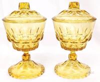 Indiana Glass Kings Crown Amber Covered Pedestal Compotes Set of 2 with Lids, Vintage Amber Glass<br/>8.5" Tall. Few small fleabites can be felt along inner lid rim. No maker's marks found.