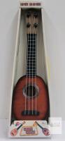 Ricochet Classic Ukulele Toy, 16-Inch Length, 4 Strings, Brown Woodgrain, Age 5+, In Box