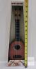 Ricochet Classic Ukulele Toy, 16-Inch Length, 4 Strings, Brown Woodgrain, Age 5+, In Box - 3