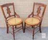 Pair Victorian Eastlake Style Cane Seat Armchairs Circa 1880 Ornate Carved Walnut/Oak Wood one seat damaged