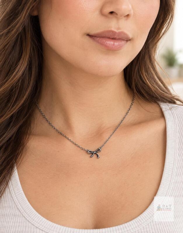 New in package Lost Souls stainless steel bow pendant necklace in silver