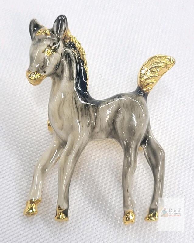 Vintage Enameled Foal / Colt Brooch featuring a Grey and Black Marbled Body with Gold-Tone Accents on the Hooves, Mane, and Tail