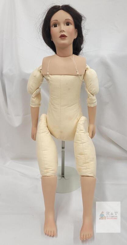 Vintage Bisque Porcelain Doll with Soft Cloth Body . Measures 28"